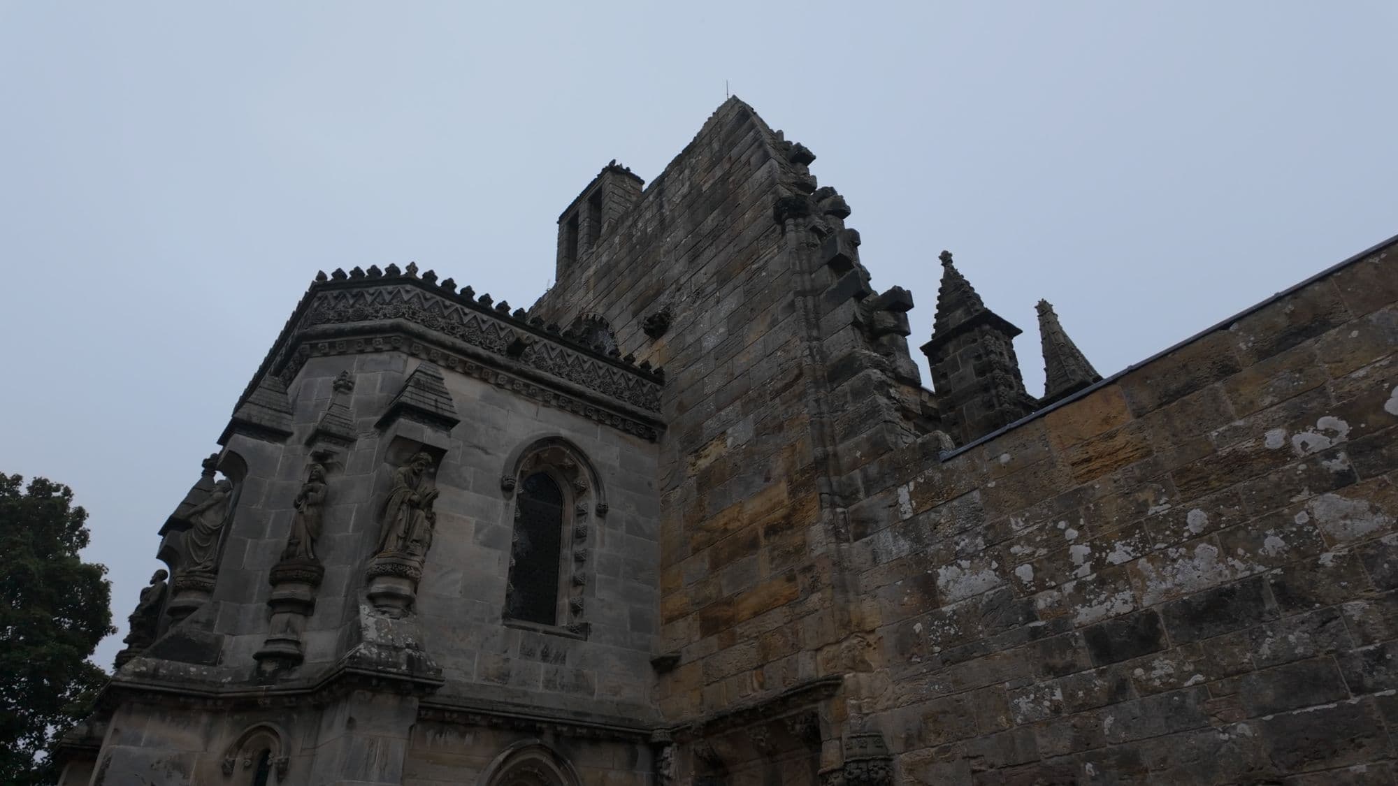 The chapel's tall, blunt west wall — the point where construction simply stopped