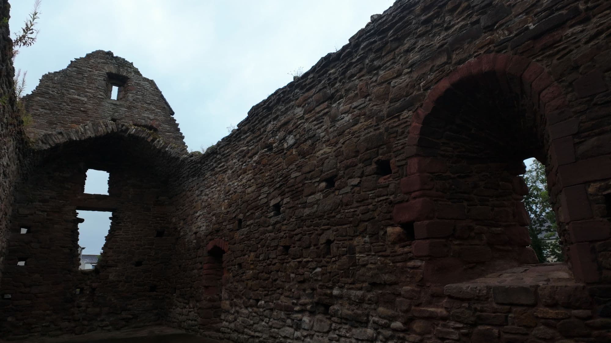 Inside St Martin's: the gable end and a big blocked arch, open to the sky