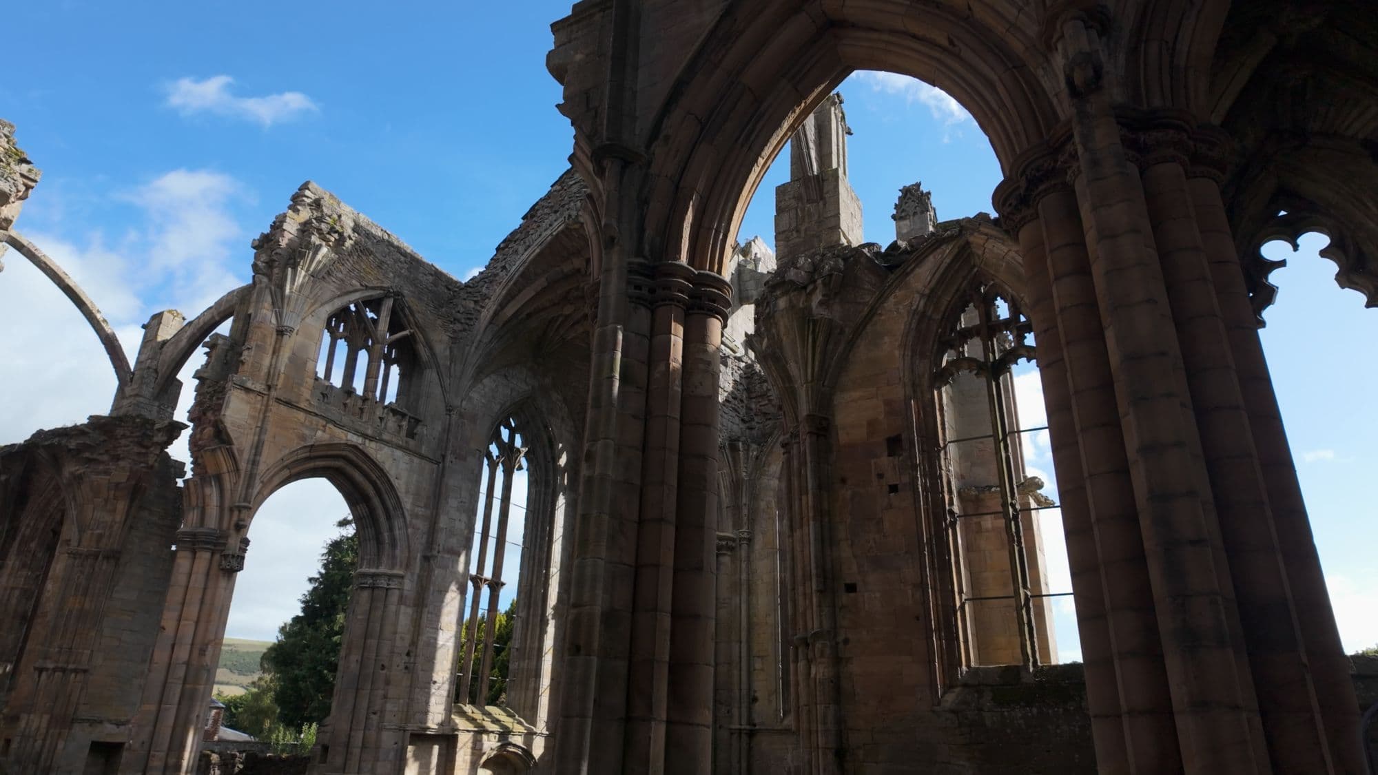 Tall pointed arches and slender pillars in the south transept, open to the sky