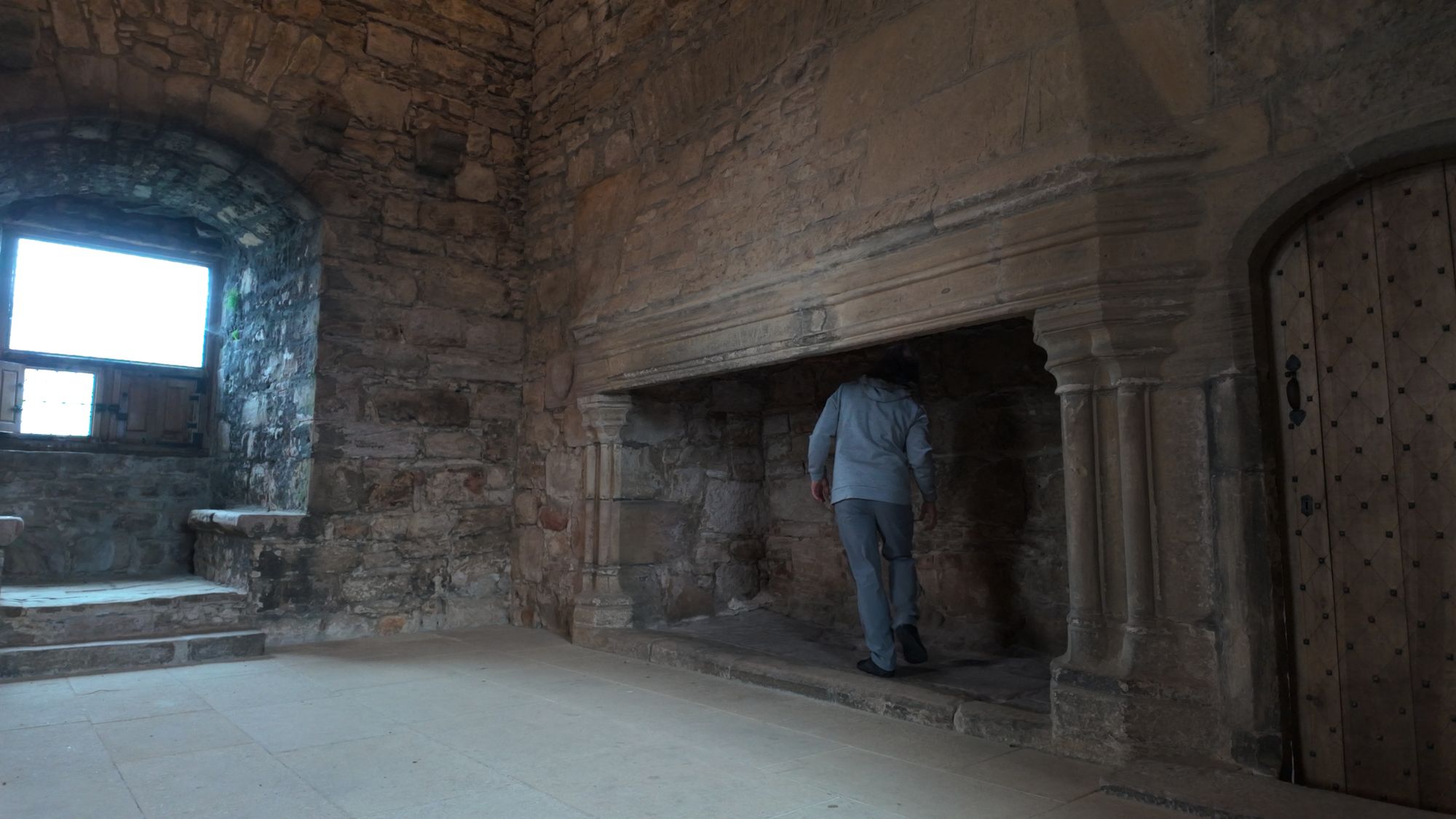 Me standing inside the great hall fireplace at Craigmillar — it's big enough to walk into