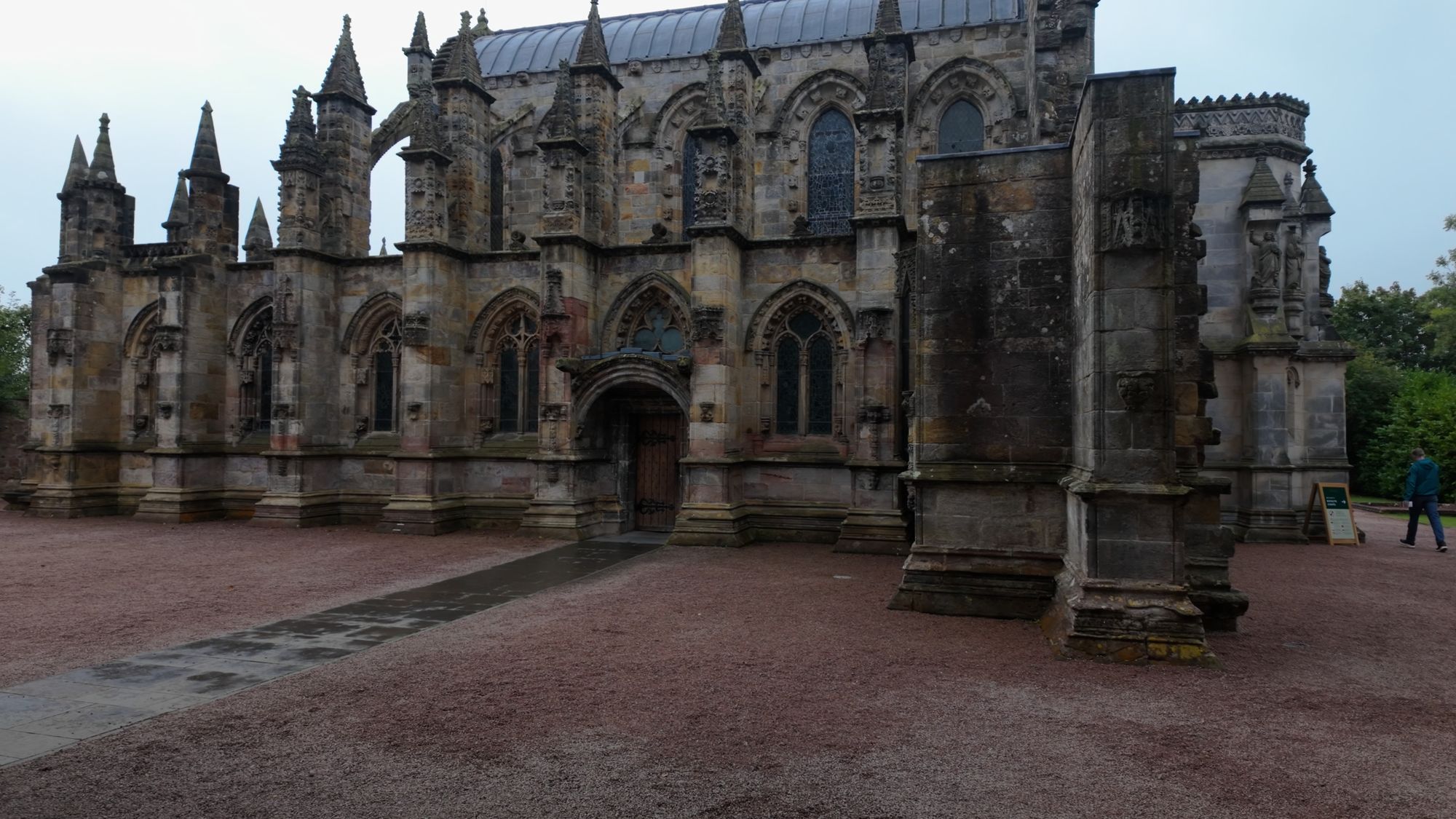 Rosslyn Chapel from the front: a forest of carved pinnacles and pointed windows along the walls