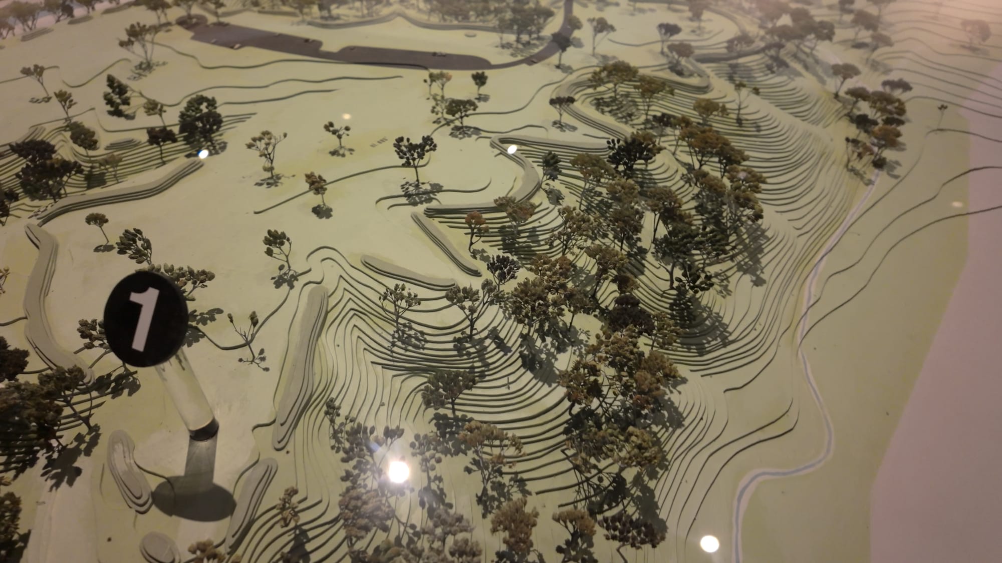 A large topographic scale model of the Fort Ancient earthworks, showing the full three-and-a-half-mile circuit of walls on the bluff