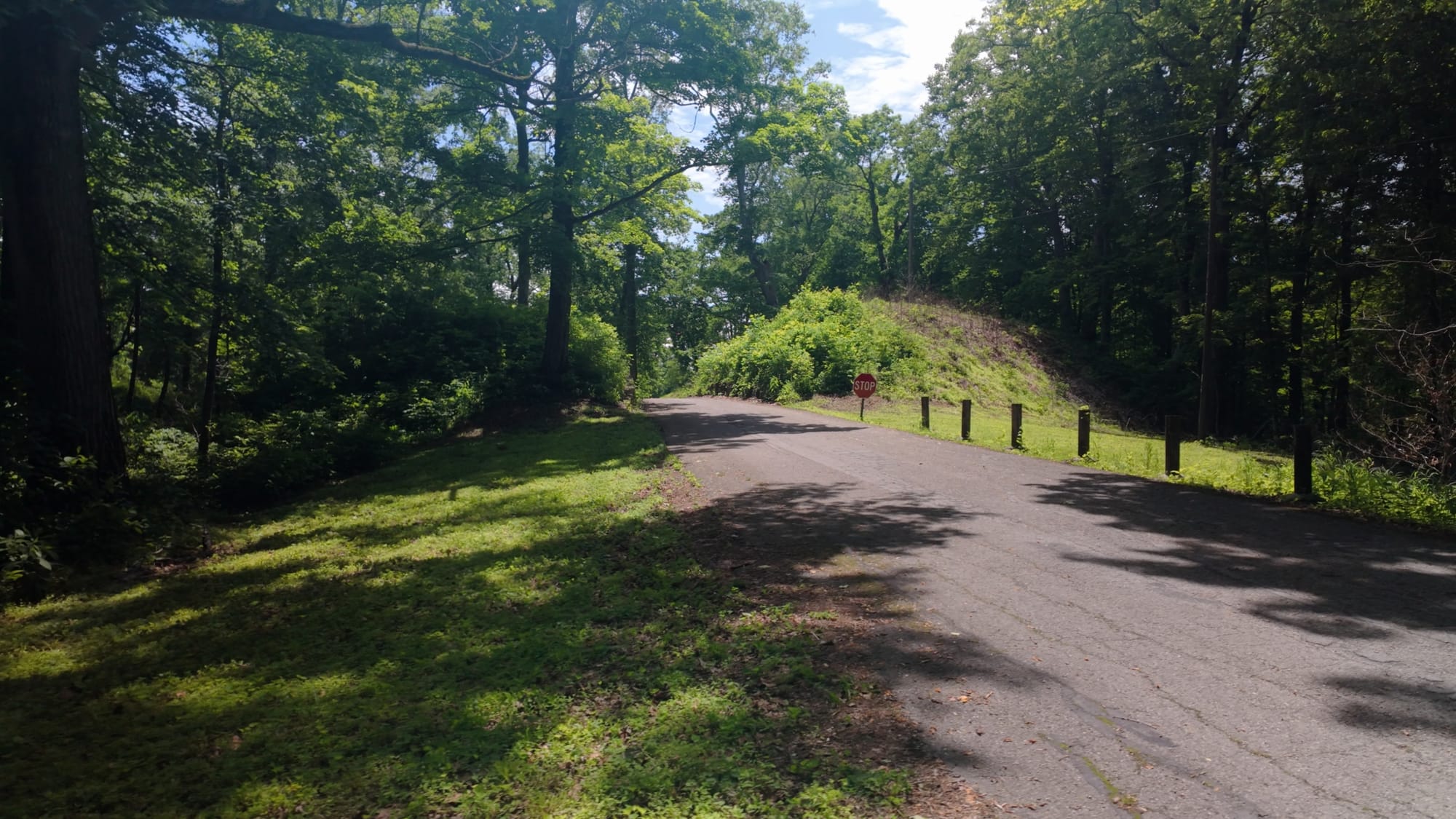 State Route 350 cutting directly through a gap in the ancient earthen wall at Fort Ancient