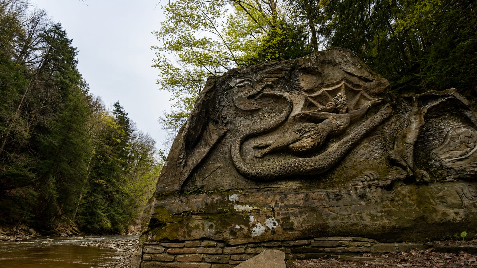 The main carved face of Henry Church Jr. Rock — a sandstone bas-relief completed in 1885 in the South Chagrin Reservation