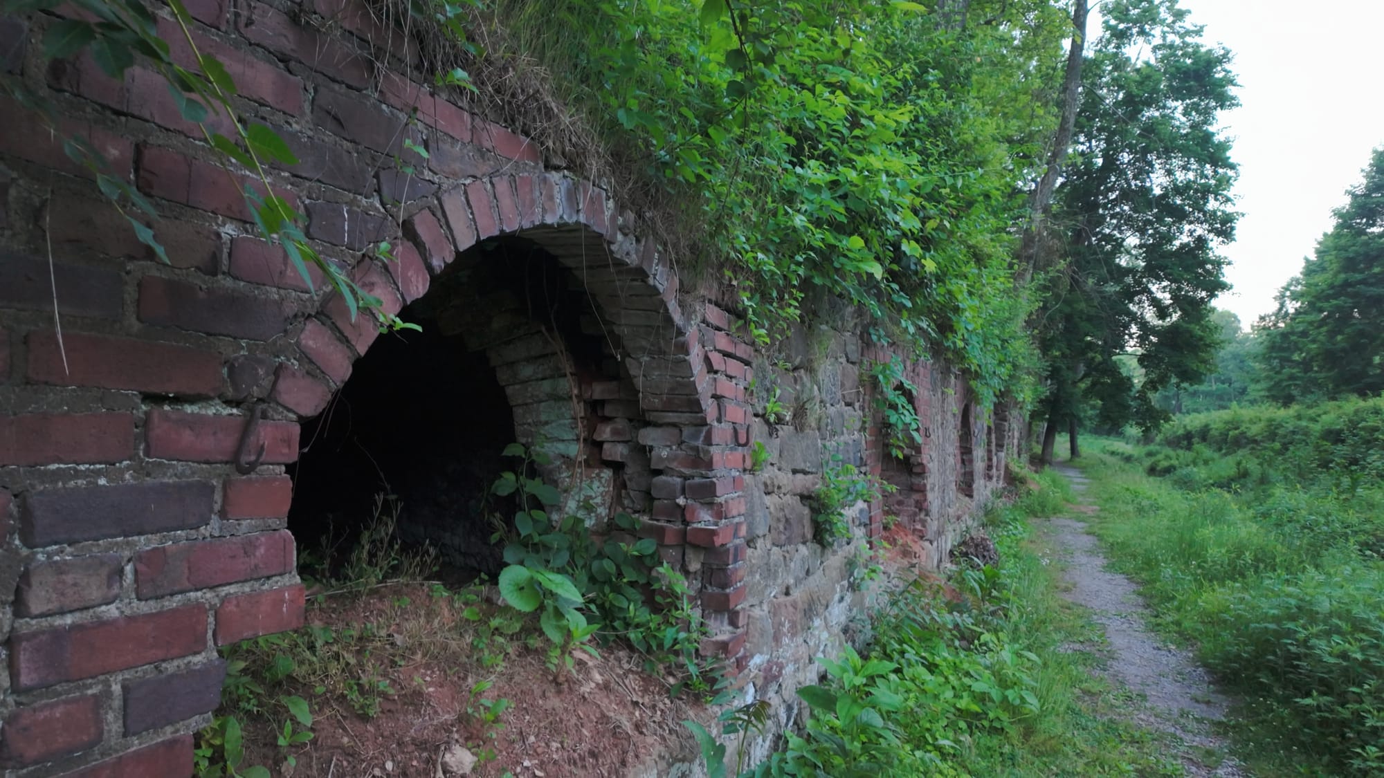Hand-laid brickwork detail, an intact dome beside a crumbling one