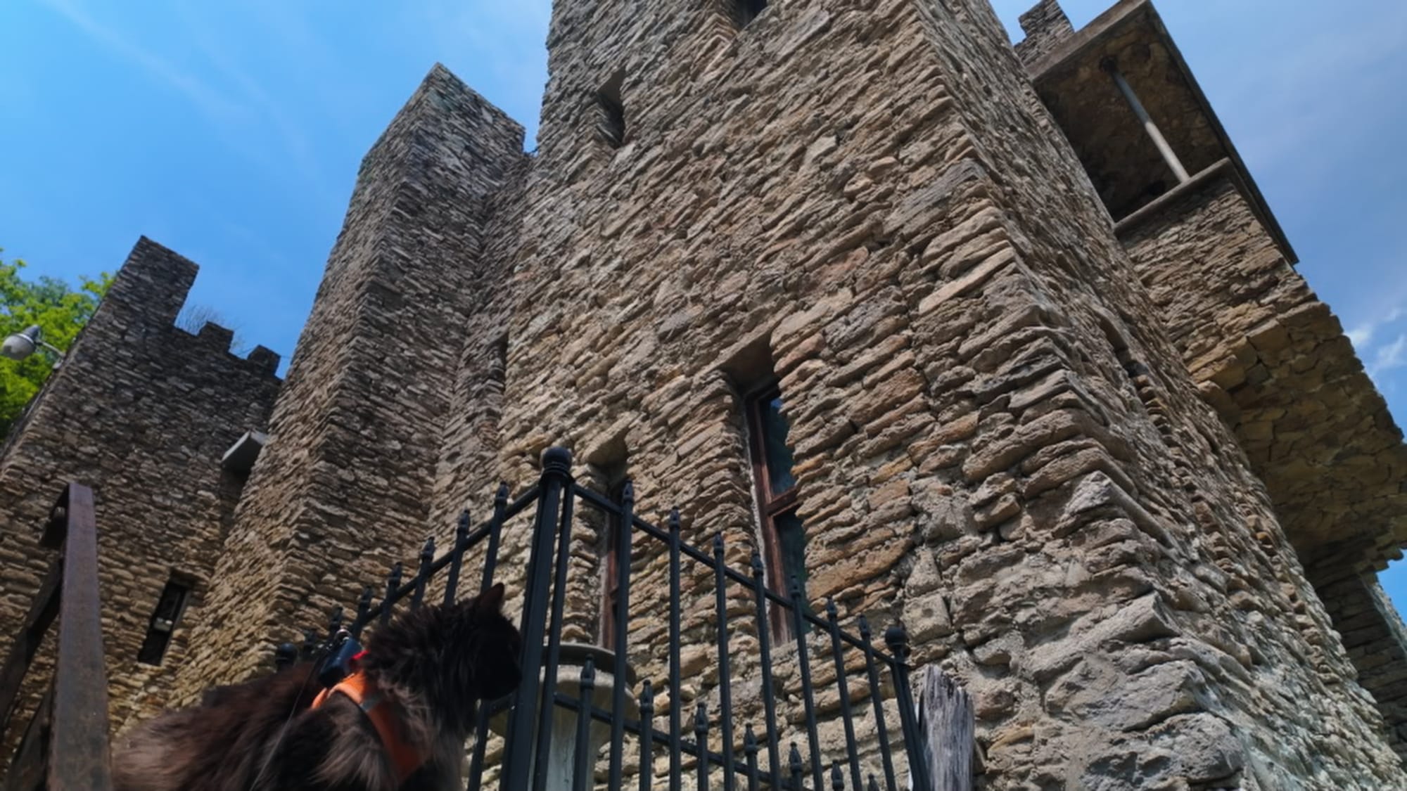 Artemis on the low wall with the castle rising behind her