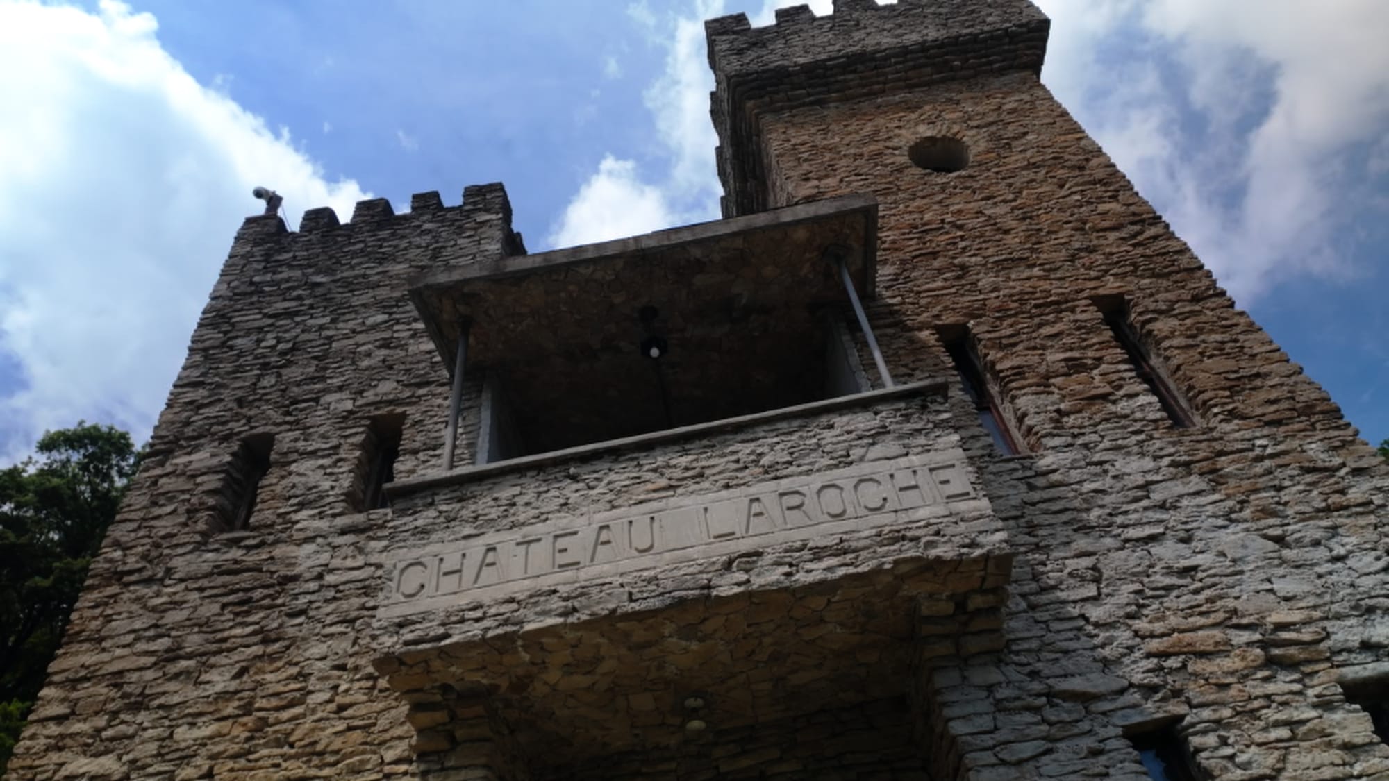 The castle's name marker — Château Laroche, named for the French military hospital where Andrews recovered