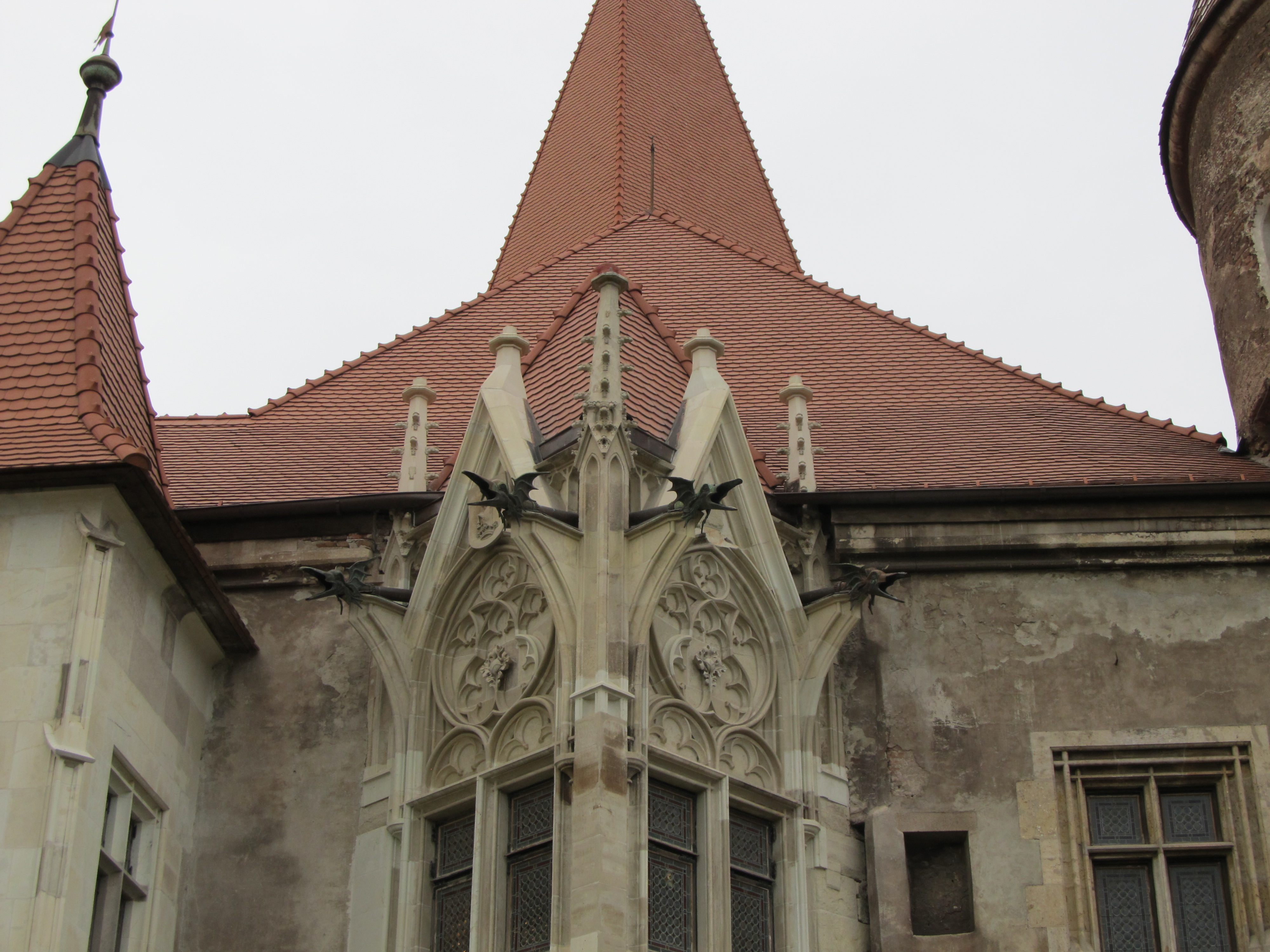 Corvin Castle's Gothic chapel facade — gargoyles included