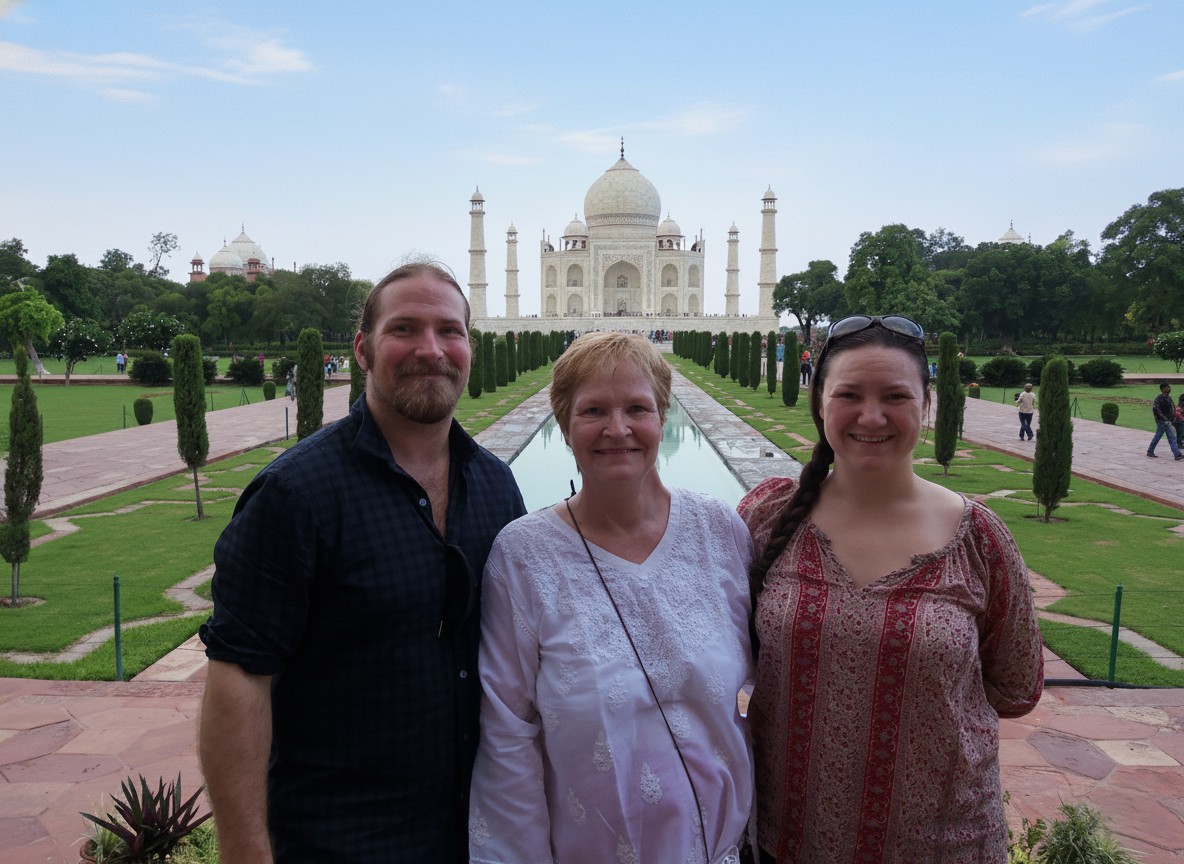 The three of us in front of the Taj Mahal — mom finally got her Wonder