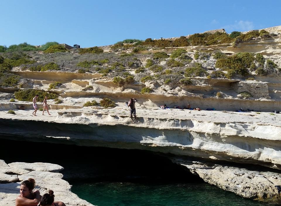 Me going off the cliff at St. Peter's Pool, Malta