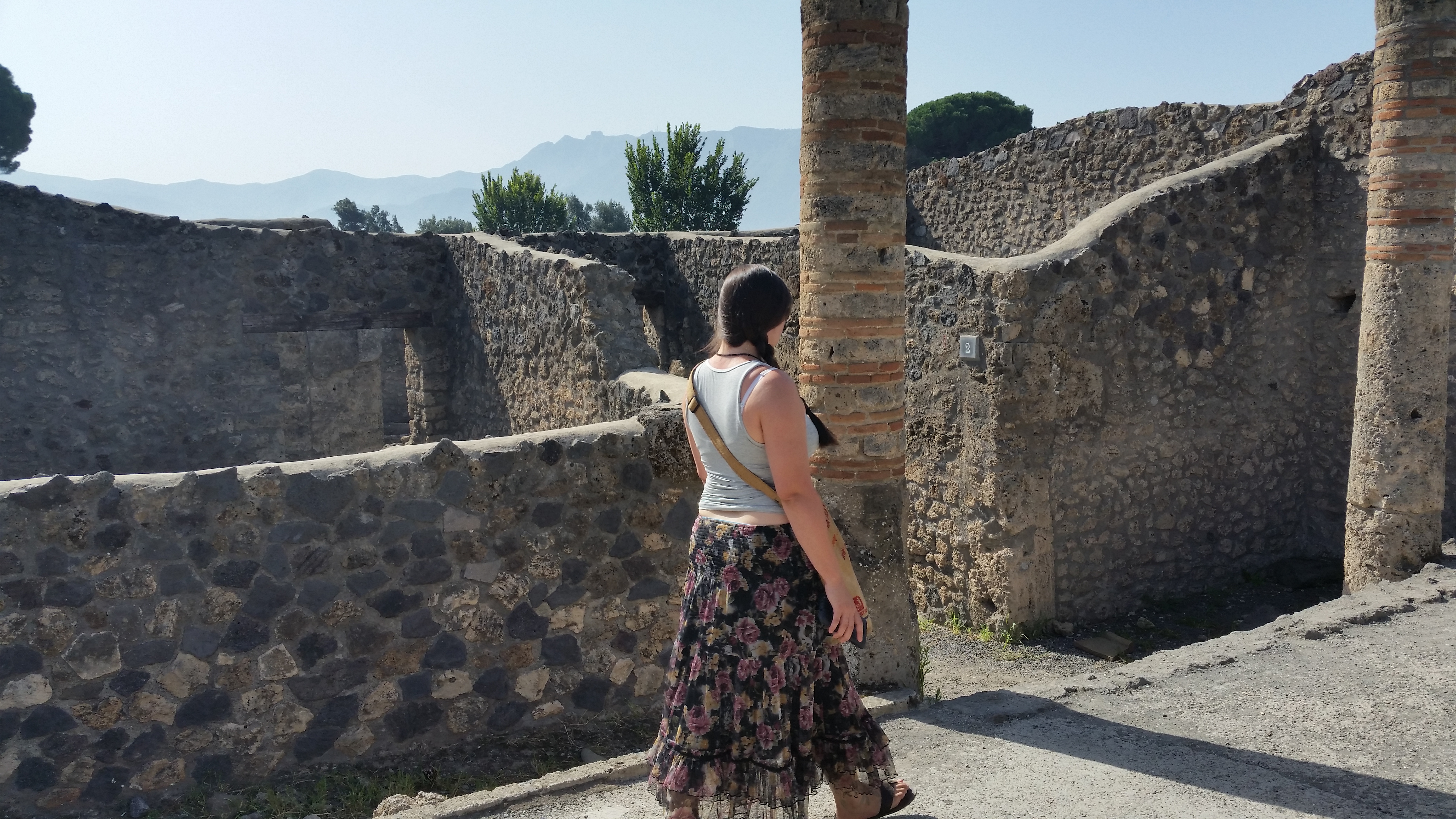 My sister exploring the ruins of Pompeii, Italy