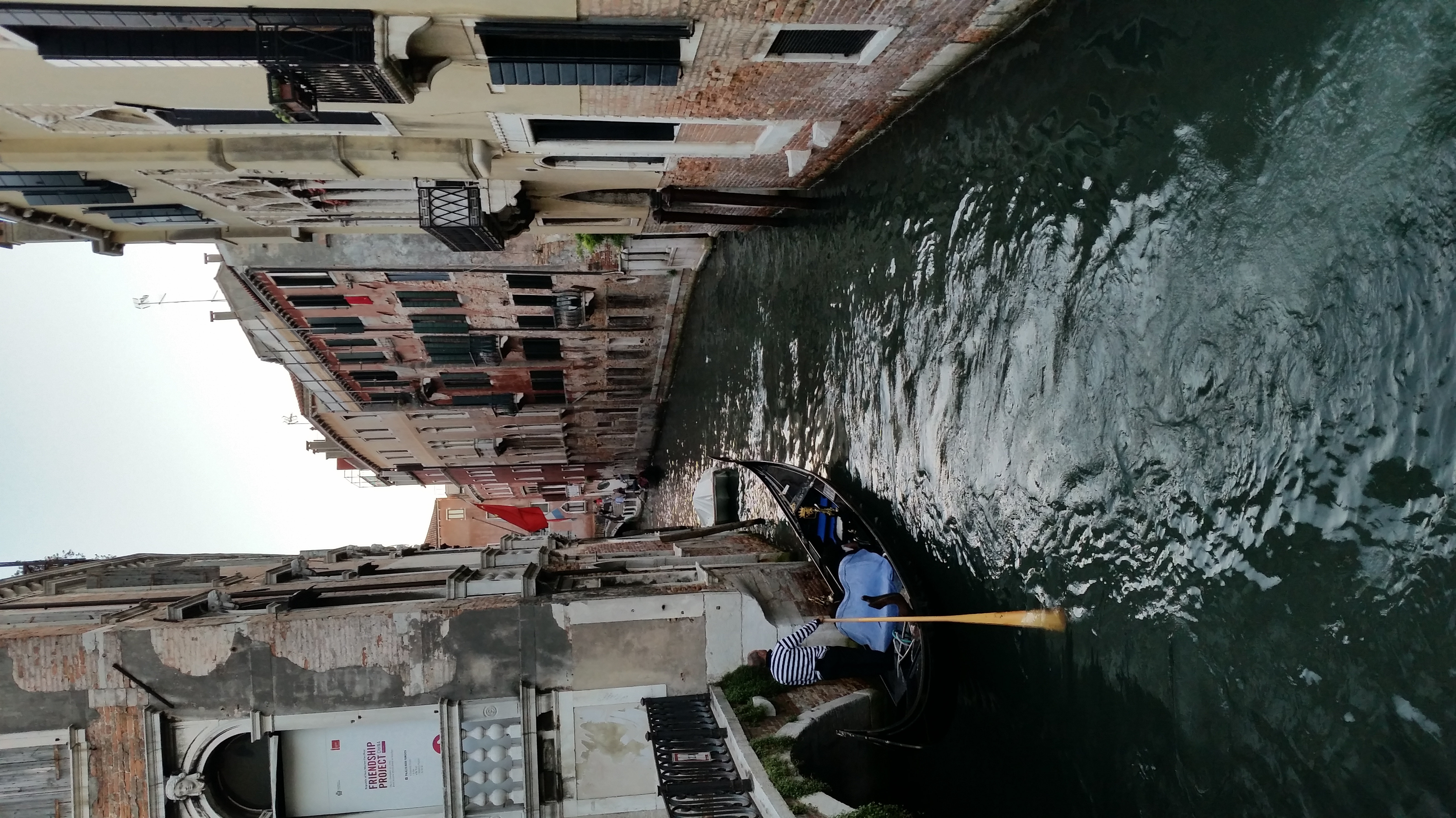 A gondola on a narrow canal in Venice, Italy
