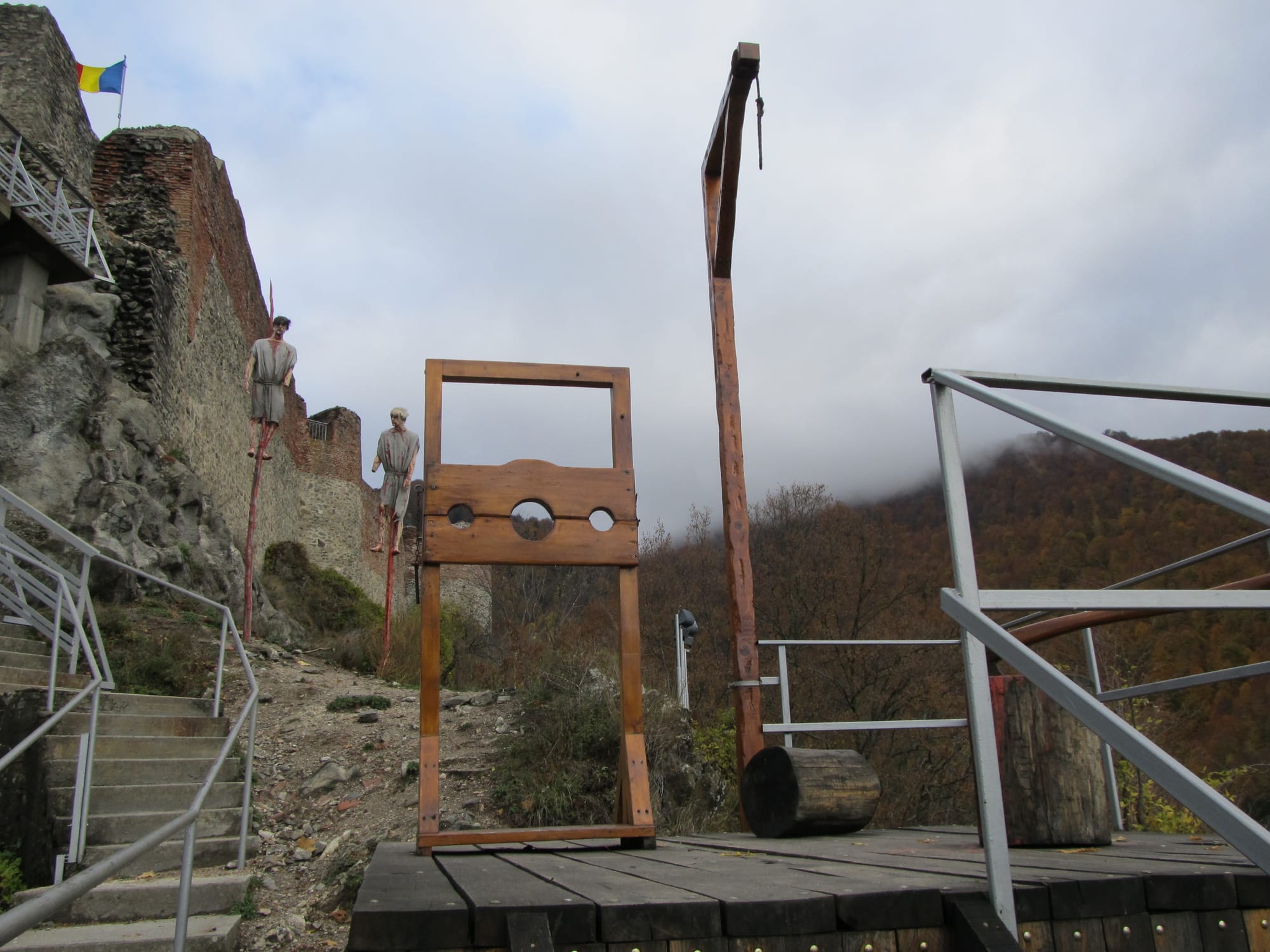 Poenari from below — the fortress sits on a cliff above the Argeș River at the top of 1,480 steps.