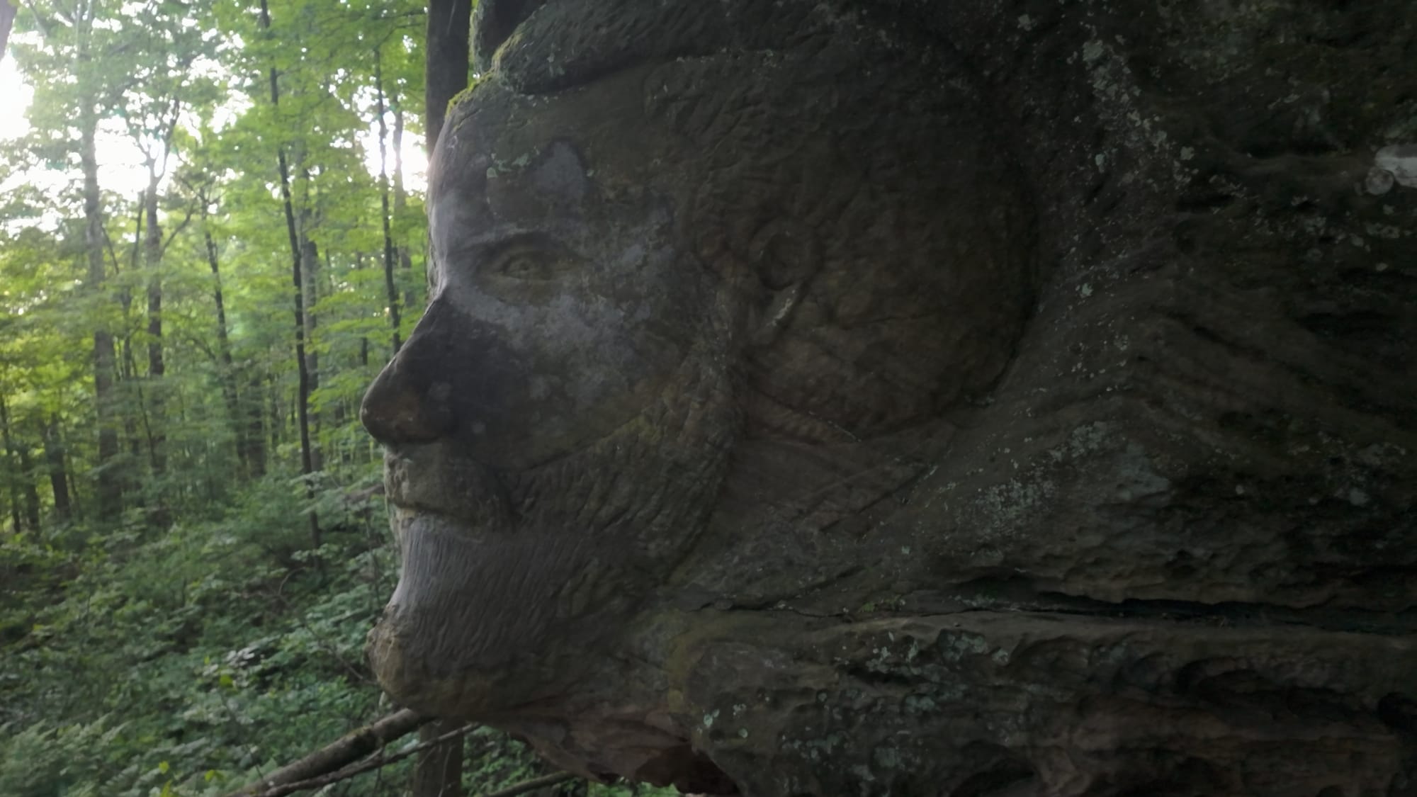 The face of Hiram Worden — the land's original owner — carved into the stone of the property he bought in 1860